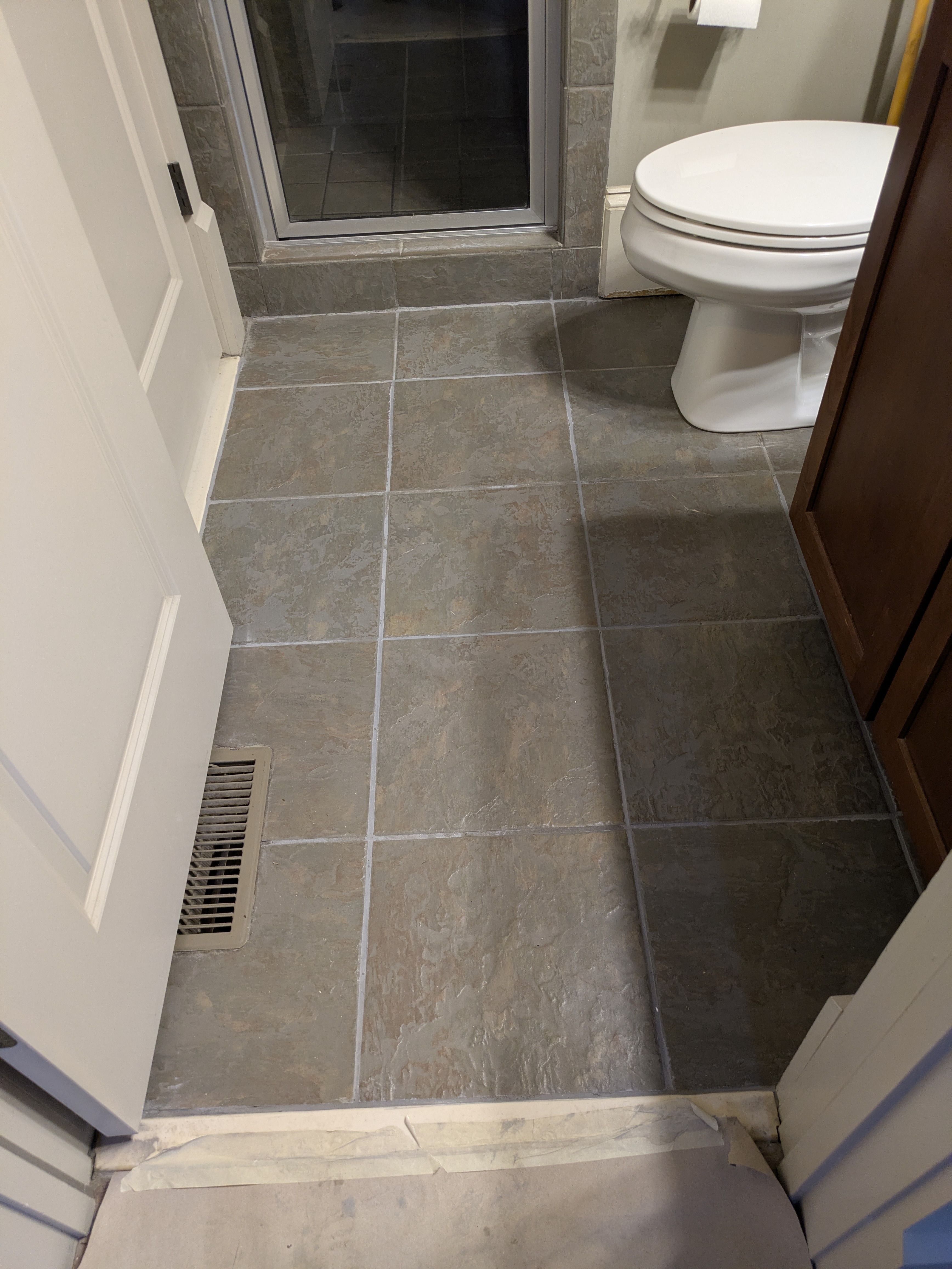 Clean grey floor tile in a finished Athens bathroom remodel